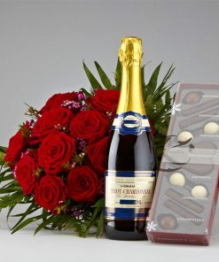 Røde roser, mousserende vin og chokolade