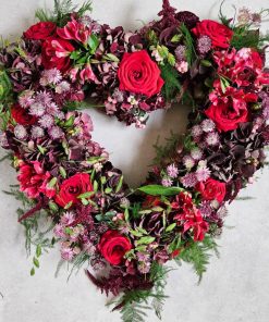 Åben blomsterhjerte i røde og lilla farver